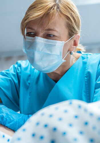 Midwife with mask on